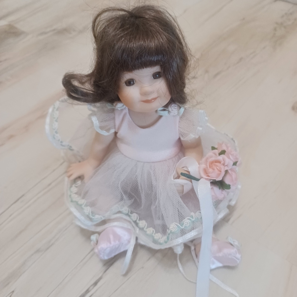 Glass doll sweet in pink.